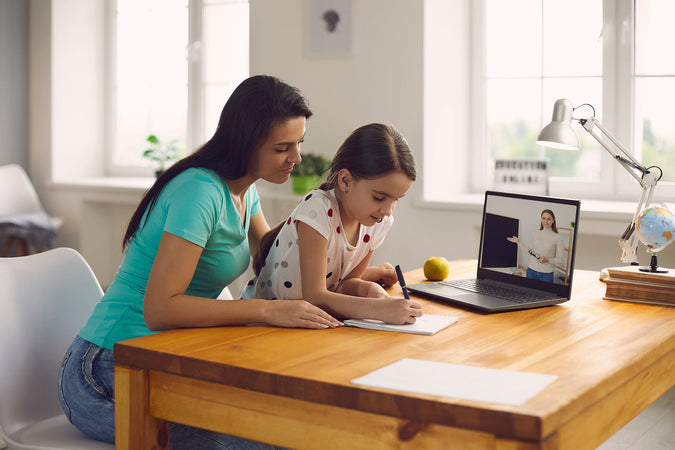 summer coding camp - Mom-And-Little-Girl-Does-A-Lesson-Listens-To-The-Teacher-Using-A-Laptop